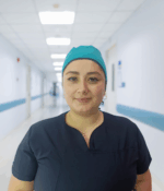 Gorro antifluido unisex color verde jade con banda ajustable para uso profesional.